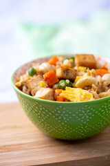  Close Up of Bowl of Tofu Cashew Fried Rice  on a Board; White and Gray Marble Countertop