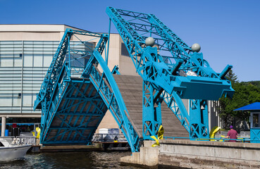 Pedestrian Drawbridge:  The sides of a foot bridge tilt upward to allow passage of boats through the harbor in Duluth, Minnesota.
