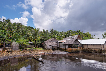Fototapeta na wymiar Asian fishing village on the sea shore.
