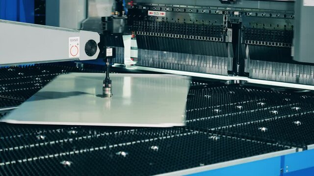 Automatic complex machine shaping large metal plate. Timelapse