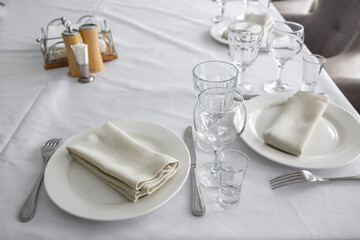 Empty wine glasses are on the table in the restaurant.