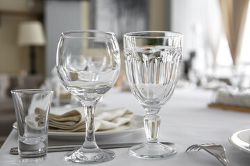 Empty wine glasses are on the table in the restaurant.