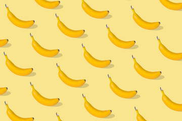 Trendy Summer pattern made with fresh banana fruit on illuminating yellow background. © Jovica Varga