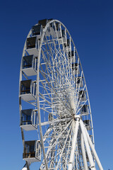 ferris wheel on a background of blue sky