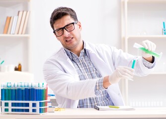 Chemistry student doing chemical experiments at classroom activi