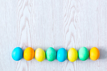 colorful easter eggs on wooden background with copy space, spring, easter concept
