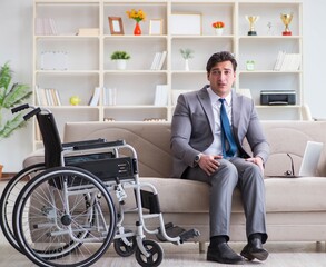 Dsabled businessman on wheelchair working home