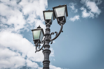 Look to the sky. Vintage street lamp.