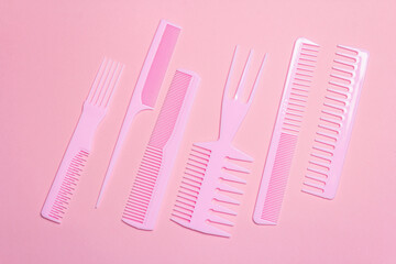 Set of hair combs on pink background