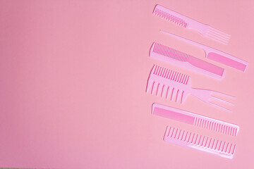 Set of hair combs on pink background