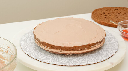 Close up baking process. Chocolate cake with cream and chocolate glaze recipe