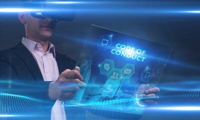 Business, Technology, Internet and network concept. Young businessman working on a virtual screen of the future and sees the inscription: Code of conduct