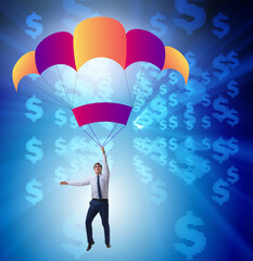 Businessman in golden parachute concept