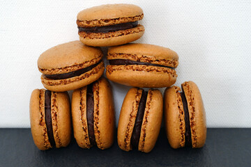 Chocolate macaron cookies filled with cocoa ganache cream