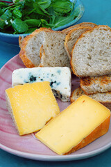 Cheese platter with toma and herdsman cheese from New Jersey and roquefort blue cheese from France