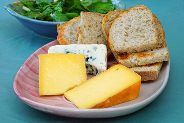 Cheese platter with toma and herdsman cheese from New Jersey and roquefort blue cheese from France