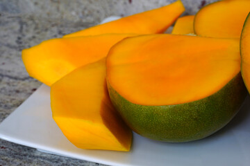 Platter of cut Kent mango fruit
