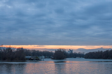 Cloudy sunset over usce, the confluence between the sava and the danube (dunav) river and the panorama of New Belgrade, also called Novi Beograd, the business district of Serbia