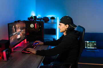 Latin man playing a video game on his gaming PC