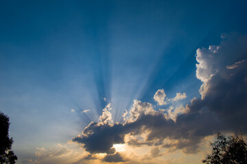 landscape picture mountain and sun rays penetrating through clouds