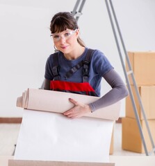 Woman preparing for wallpaper work