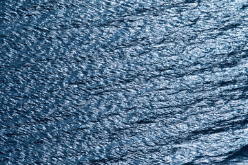 Blue tropical sea surface with waves and ripples
