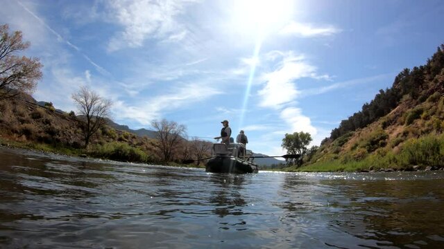float fishing on a scenic river in the mountains 