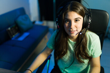 Attractive woman gamer about to live stream while playing a videogame © AntonioDiaz