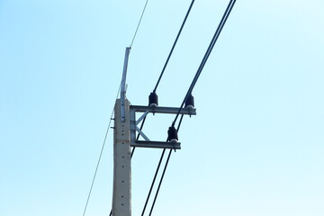 Electric pole with cable fixing device