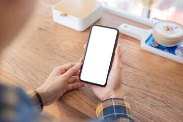 cell phone blank white screen mockup.woman hand holding texting using mobile on desk at office.background empty space for advertise.work people contact marketing business,technology