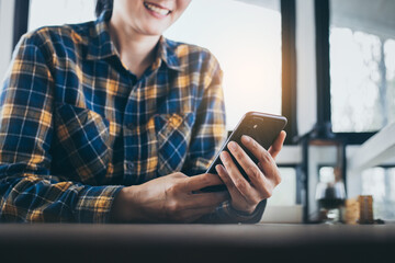 using cell phone hand holding mobile texting message contact us.chatting,search internet...