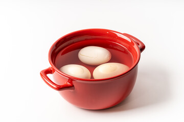 Fresh hard-boiled egg on pure white background