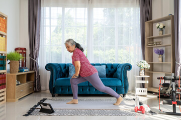 Retirement woman doing exercise at home during quarantine