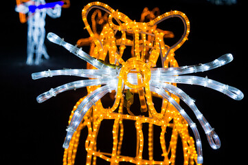 Figure of a fairytale beaver made of garlands of light in a city park