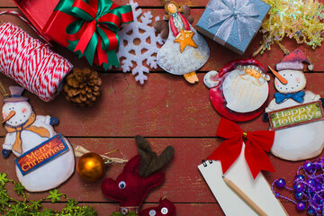 Christmas background with decorations on wooden background.