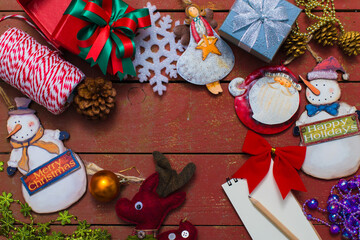 Christmas background with decorations on wooden background.