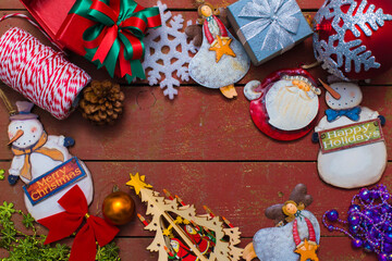 Christmas background with decorations on wooden background.