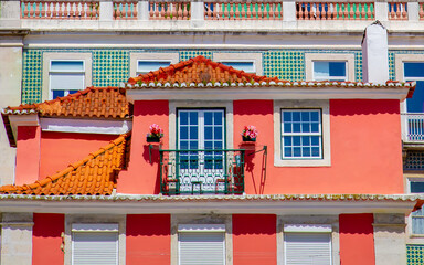 Colorful buildings of Lisbon historic center near landmark Rossio Square.