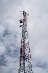 Obraz premium Telco Trellis for 4G 5G Apocalypse Internet Communication, FM Radio and Television Broadcasting On Air with Blue Sky in Background.