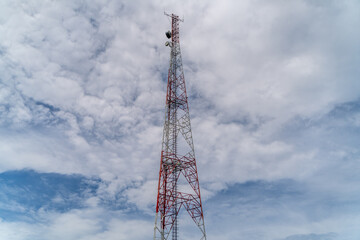 Telco Trellis for 4G 5G Apocalypse Internet Communication, FM Radio and Television Broadcasting On Air with Blue Sky in Background.