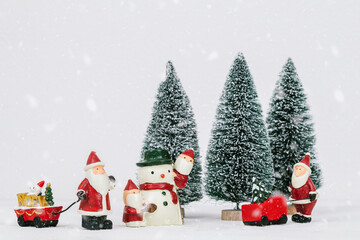 Many Santa Claus prepare decoration for Cristmas holiday festival.