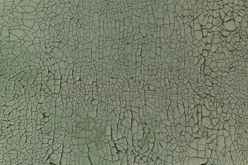 Texture of old painted cracked plywood of green color, pattern, texture, abstract drawing