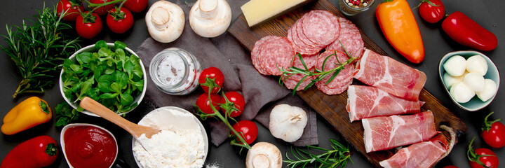 Italian pizza preparation. Variety of traditional cooking ingredients.