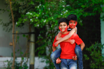 Cute indian little child’s group playing holi. Holi is colors festival in india