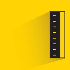ruler with shadow on yellow background