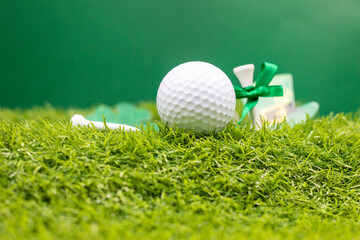 Golf ball with St. Patrick's Day decoration on green grass