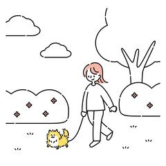 犬と公園を散歩する女性