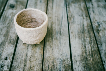 earthenware on wood 
table 