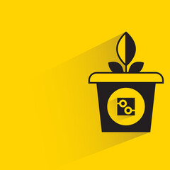 plant pot and sensor with shadow on yellow background