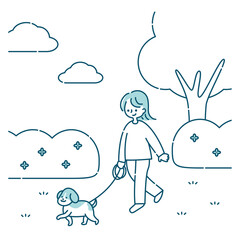 犬と公園を散歩する女性